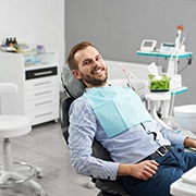 Man with dental implants in Los Alamitos, CA sitting back in dental chair