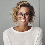 a woman smiling after undergoing professional teeth whitening