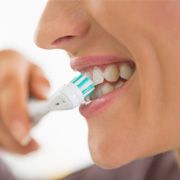 a person brushing their teeth 