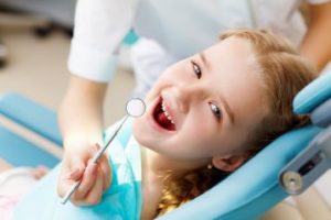 Smiling child in the dental chair 