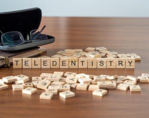 wooden blocks spelling out "teledentistry"