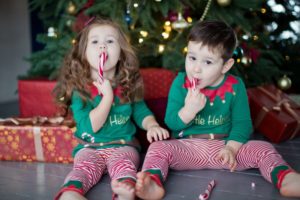 little boy and girl with candy canes