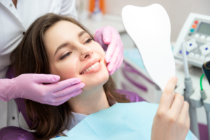 a patient smiling and receiving cosmetic dental work